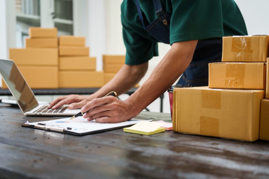 a man is working at his desk preparing parcel box 2026 01 08 07 54 03 utc