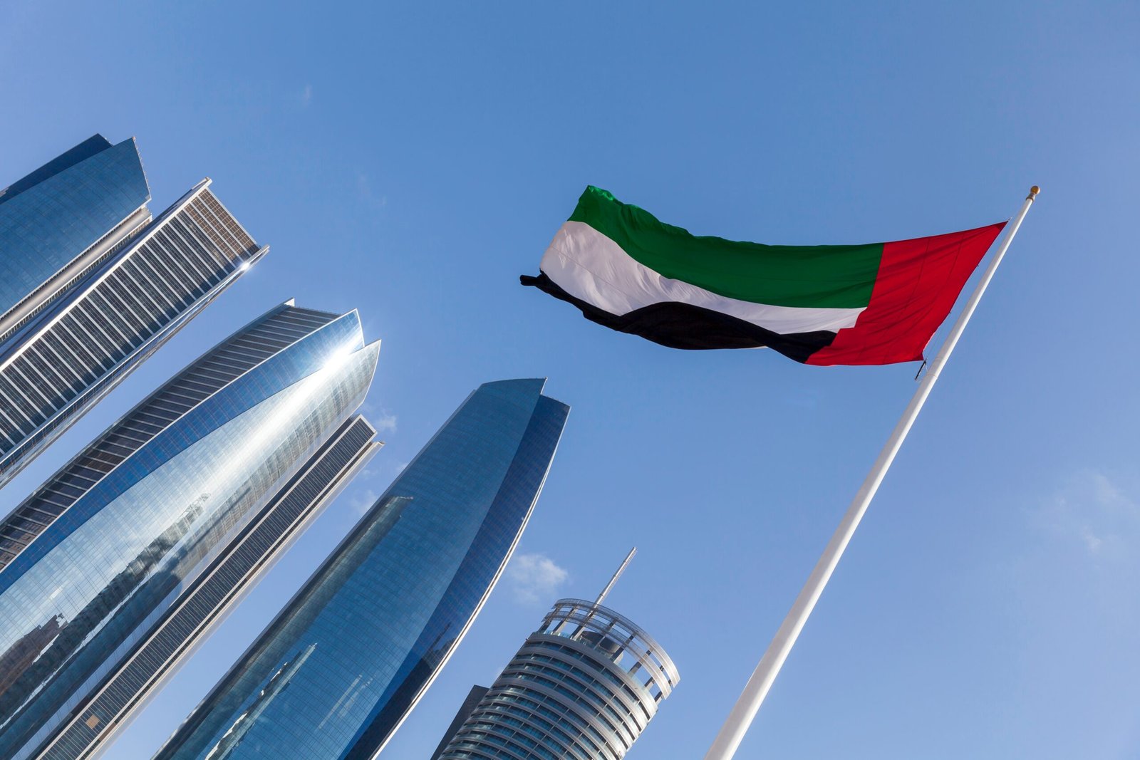 uae flag with modern high rise buildings at the ba 2026 01 08 07 41 59 utc scaled